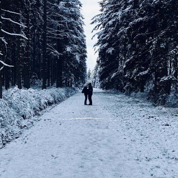 couple standing in snow